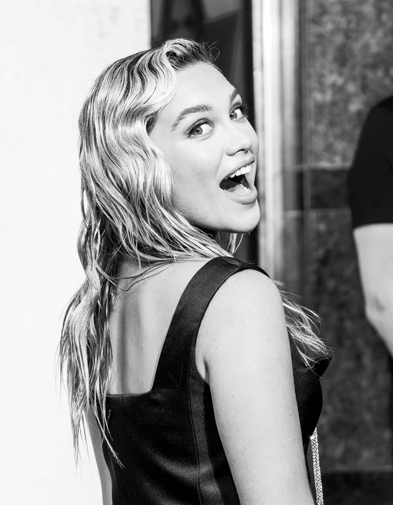 A black-and-white portrait of Florence Pugh smiling at the Black Widow premiere in London, June 2021. © Mike Marsland/WireImage via Getty Images
