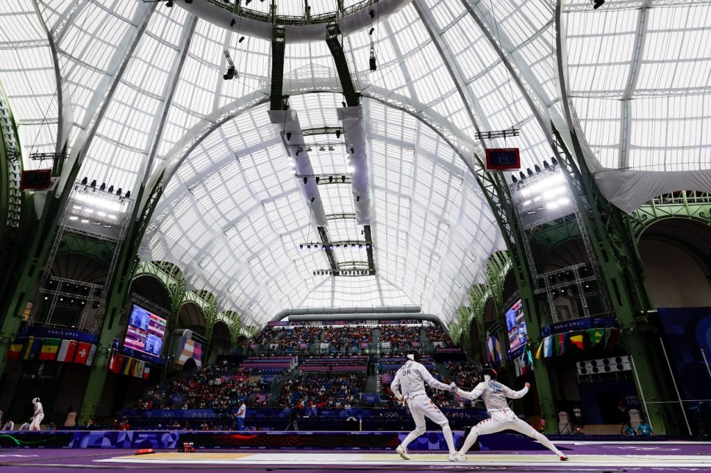 Jie Xu of China and Blake Broszus of Canada competes during Men's Foil Team Classifications 5-8 of the Fencing on Grand Palais - Yellow Piste during the Paris 2024 Olympics Games on August 4, 2024 in Paris, France. (Photo By Antonio Martinez/Europa Press via Getty Images)