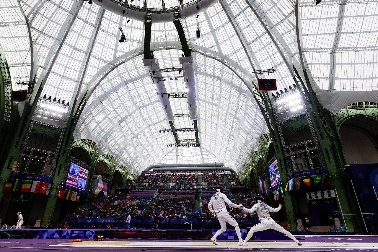 Jie Xu of China and Blake Broszus of Canada competes during Men's Foil Team Classifications 5-8 of the Fencing on Grand Palais - Yellow Piste during the Paris 2024 Olympics Games on August 4, 2024 in Paris, France. (Photo By Antonio Martinez/Europa Press via Getty Images)