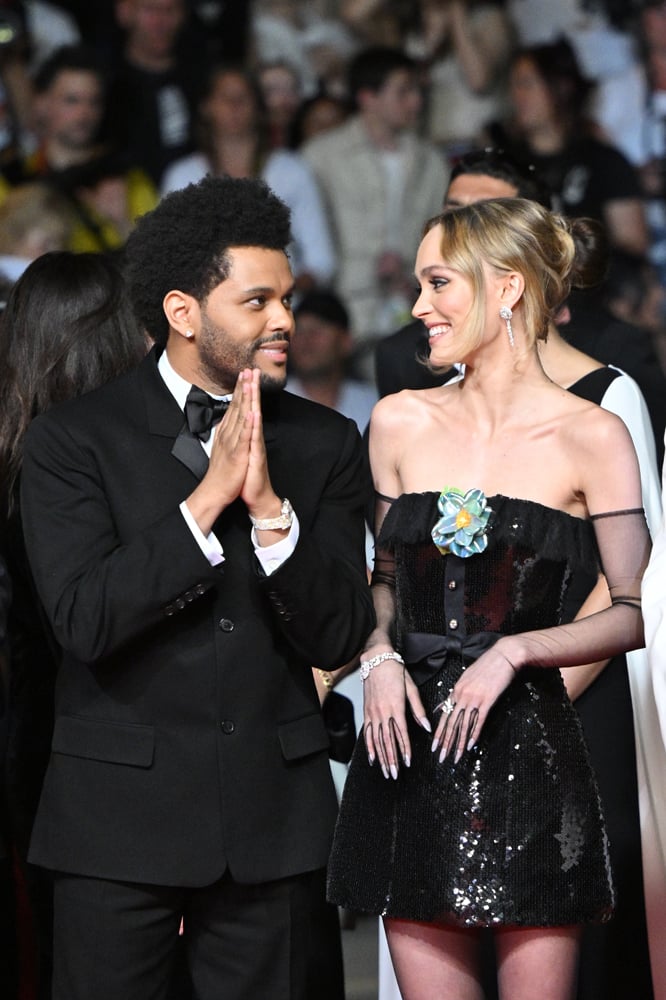 Abel 'The Weeknd' Tesfaye, Lily-Rose Depp assistent au tapis rouge de The Idol lors de la 76ème édition du festival de Cannes au Palais des Festivals le 22 mai 2023 à Cannes, France © Stephane Cardinale - Corbis/Corbis via Getty Images.