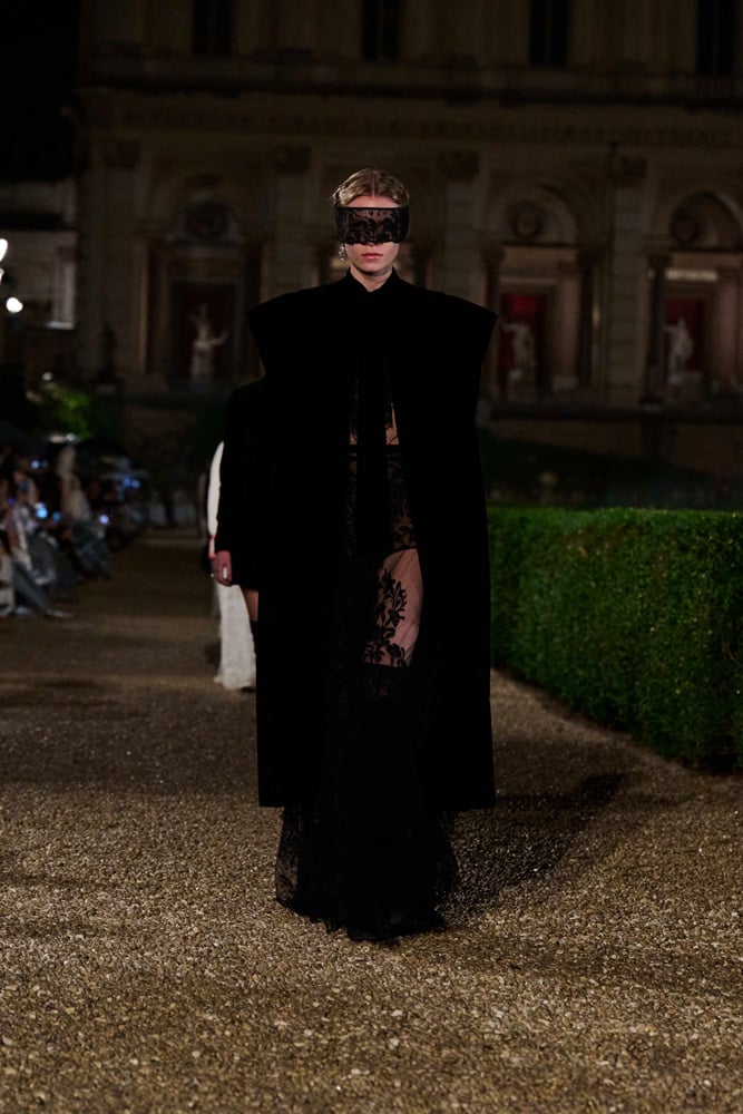 Black, see-through dress with cape by Maria Grazia Chiuri