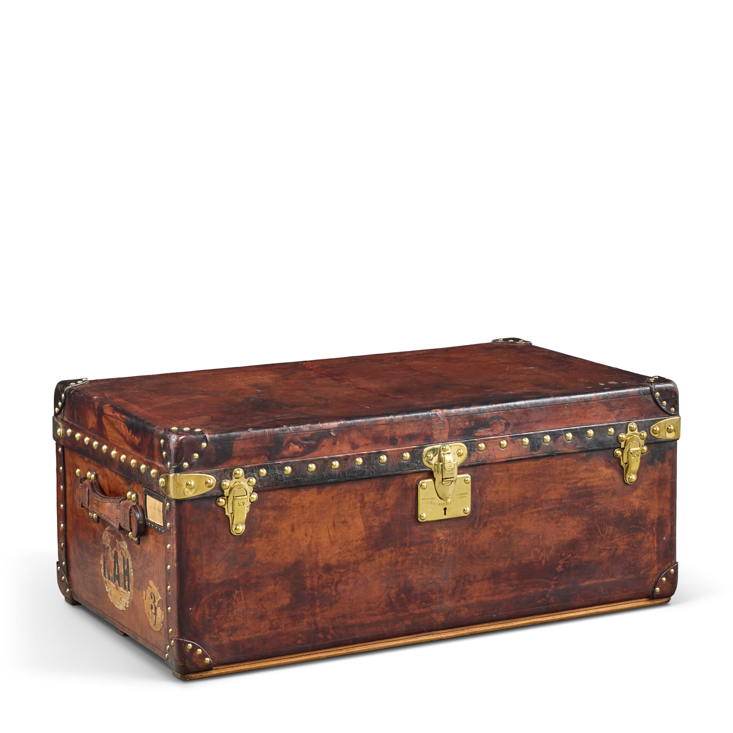 Natural cowhide leather Aero trunk with brass hardware, Louis Vuitton, 1934, auctioned by Christie's in Paris.