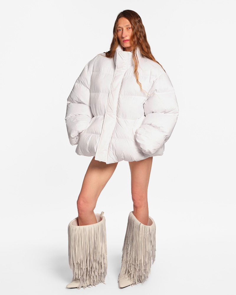 White down jacket and white boots with fringes