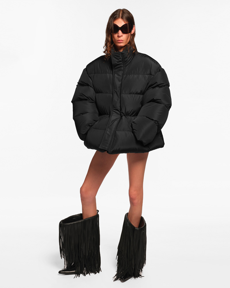 Black down jacket and black boots with fringes