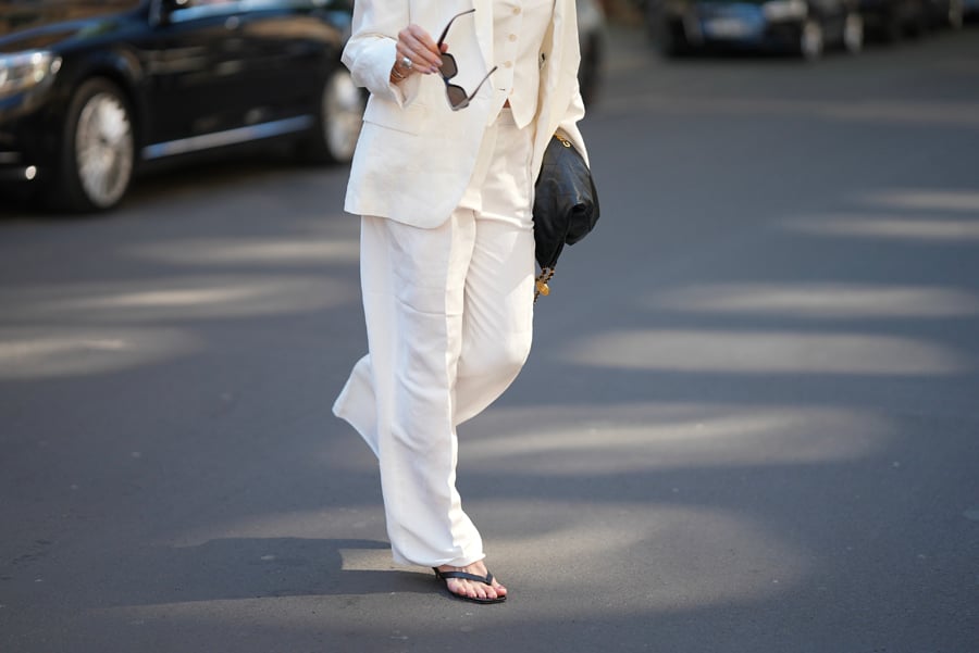 Trendy black leather flip-flops