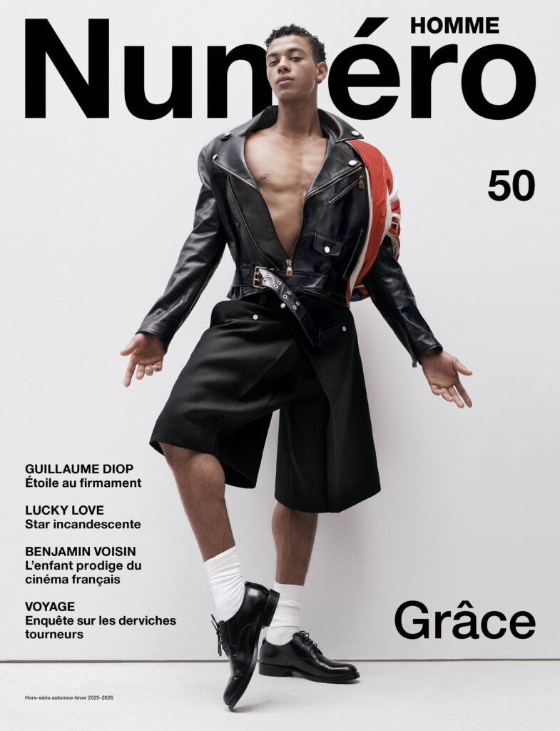 GUILLAUME DIOP photographed by Jean-Baptiste Mondino, styling by Charles Varenne. Zipped leather jacket and wool flannel bermuda shorts, LOUIS VUITTON. Socks, FALKE. Derbies, DOLCE & GABBANA. Vintage scarf. Hair: Sacha Massimbo Molingo. Makeup: Angloma using Augustinus Bader products. Photography assistants: Margaux Jouanneau and Loup Catusse. Styling assistants: Arthur Callegari and Lou Gueguen. Digital tech: Tsuvasa Saïkusa at D-Factory. Retouching: Marco Giani. Production: Iconoclast Image.