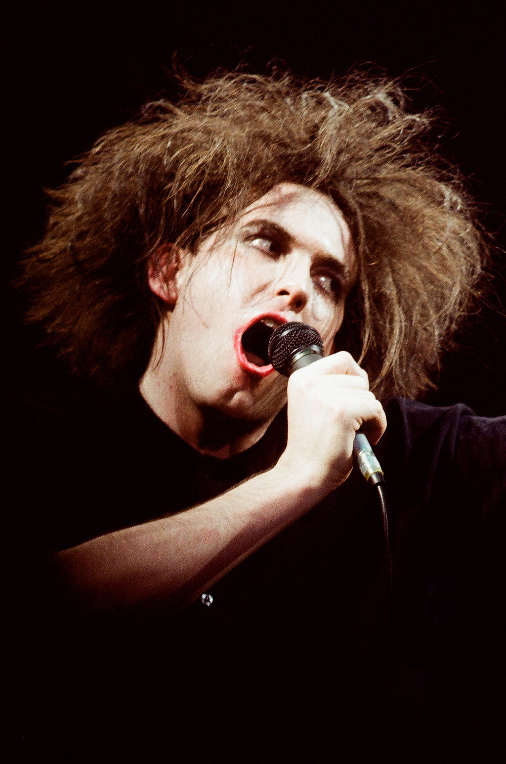 Robert Smith de The Cure au Royal Albert Hall, le 25 avril 1986, à Londres. © Pete Still/Redferns.