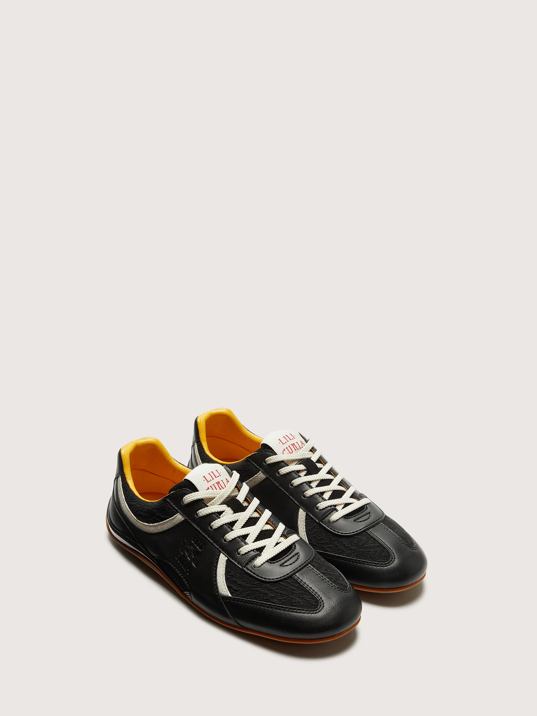 Sneakers Zola en cuir Napa noir, 280 €, Lila Curia.